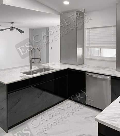 high gloss black kitchen cabinets | white countertops